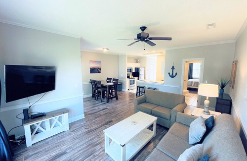 Central Myrtle Beach Condo | Endless Summer Coastal Condo at Magnolia Place - Pool & Golf Course Views!