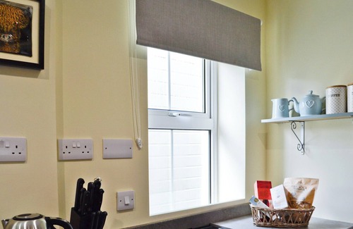 Mauchline Cottage | Enjoy a game of tennis or simply relax in the hot tub at The Brewers Cottage.