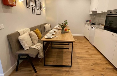 Raamsdonksveer Apartment | Enjoy a stylish room designed for both relaxation and productivity. Sleep soundly on a luxurious box-spring bed (twin or double setup), work or dine comfortably at your table, and stay cool with air conditioning. Your private bathroom, TV, and fridge