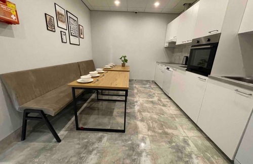 Raamsdonksveer Apartment | Enjoy a stylish room designed for both relaxation and productivity. Sleep soundly on a luxurious box-spring bed (twin or double setup), work or dine comfortably at your table, and stay cool with air conditioning. Your private bathroom, TV, and fridge