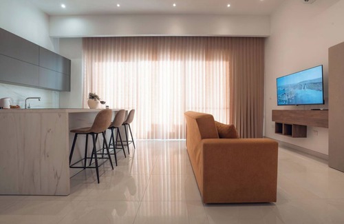 Mellieha House | Enjoy luxury and comfort in this modern 3-story home in Mellieħa with a private lift, rooftop jacuzzi, sea and countryside views, 3 bedrooms, 3 bathrooms, and spacious terraces. Perfect for families or friends just minutes from Malta’s best beaches.