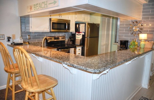 Myrtle Beach Condo | Enjoy the breeze from the screened in porch on summer nights - Summertree F2