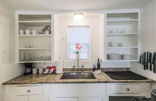 Shady Acres House | Enjoy two separate, fully furnished homes on one property — perfect for large groups. The front home offers 3 bedrooms and 1 bath, while the back two-story home features 3 bedrooms, 2 baths, and an upstairs family room with 2 beds