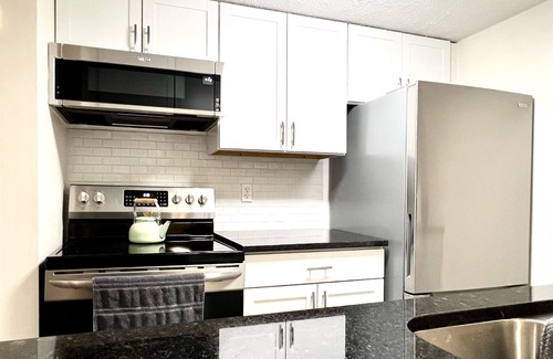 Vandalia Condo | Executive Condo: King primary en-suite! A part of the Uptown Collective Suites