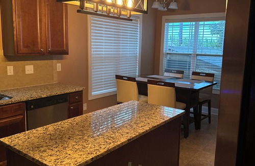 Olivia House | Executive style home in Lillington, NC with outdoor kitchen and fire pit