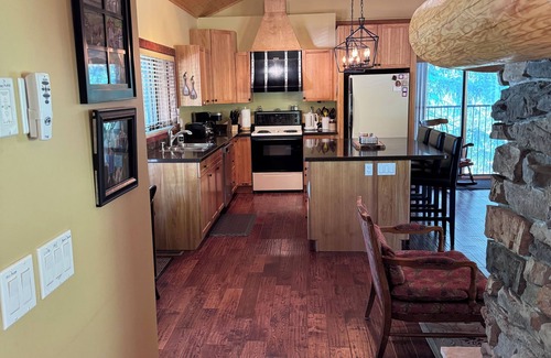 Anglemont House | Experience the warmth of our gorgeous log home backing onto the first fairway.