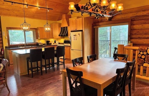 Anglemont House | Experience the warmth of our gorgeous log home backing onto the first fairway.