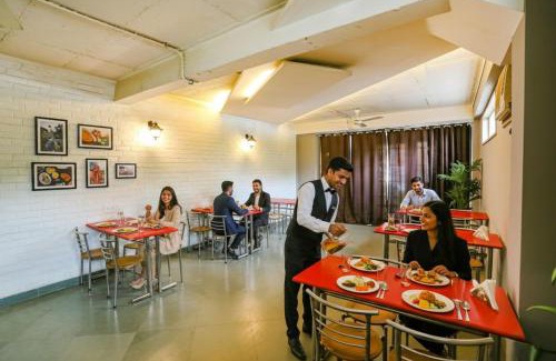 Sushant Lok Hotel | FabHotel Premium Nest Near Golf Course Road