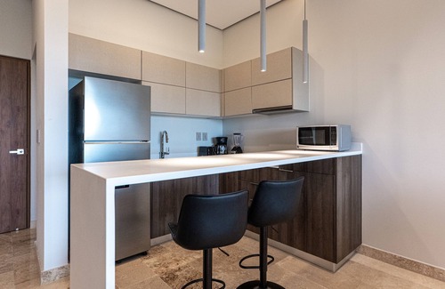 Playa Paraiso Condo | Family-friendly coastal condo with rooftop pool, fire pits & market