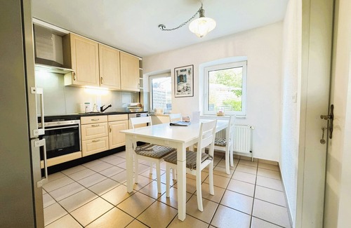 Grundhof Apartment | Family-friendly Krischan vacation apartment with quiet, fenced garden.