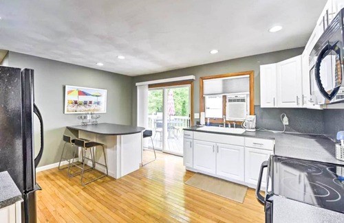 Narragansett Apartment | Family friendly yard, with deck and gas BBQ. The perfect place to relax and enjoy Narragansett!