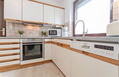 Malente Apartment | Ferienwohnung Hütt 3 mit Wintergarten im Haus Hüttmann in Bad Malente