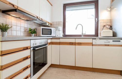 Malente Apartment | Ferienwohnung Hütt 3 mit Wintergarten im Haus Hüttmann in Bad Malente
