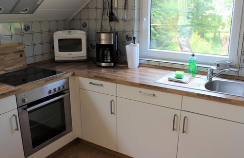 Butjadingen Apartment | Ferienwohnung Wintergarten - Ferienhaus "Am Deich 30"