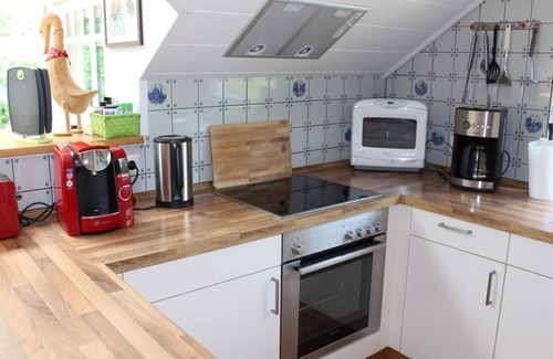 Butjadingen Apartment | Ferienwohnung Wintergarten - Ferienhaus "Am Deich 30"