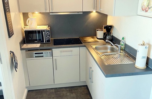Heiligenhafen Apartment | Friendly and renovated apartment with laminate flooring on the 14th floor.