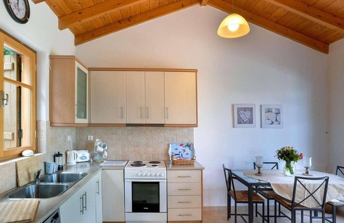 Longos House | From its elevated position directly above Levrecchio beach, this wonderfully light and airy villa en
