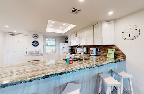 South Padre Island Condo | Fully Renovated Getaway with Beachfront Patio - Steps to Pool & Hot Tub