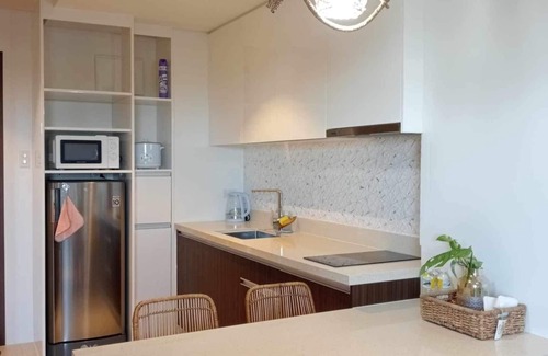 Maribago Condo | Fun at the beach splash in pools or just relax and enjoy the serenity of nature