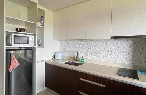 Maribago Condo | Fun at the beach splash in pools or just relax and enjoy the serenity of nature