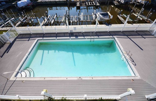 North Ocean City Condo | Fun, welcoming 2 bedroom condo with free WiFi, outdoor pool, and direct canal and bay view located midtown!