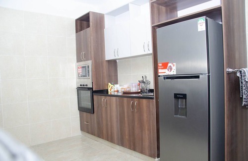 Nairobi West Apartment | Get a magnificent aerial view of the expansive Nairobi game Park from a balcony