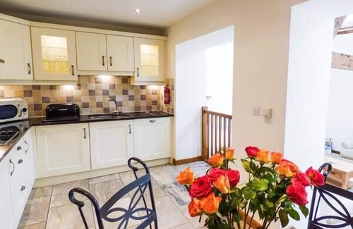 Kendal Cottage | GHYLL BANK COW SHED, pet friendly, with a garden in Staveley