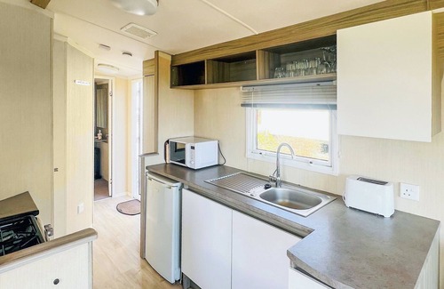 Saint Ann's Chapel House | Good quality, modern family caravan with one double and one twin.