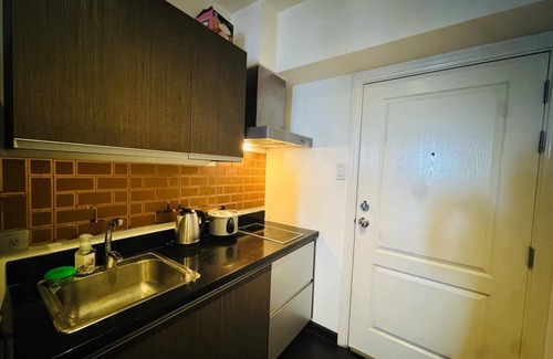 Downtown Hotel | Gramercy Residences studio with Balcony facing city skyline
