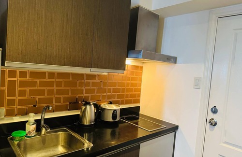 Downtown Hotel | Gramercy Residences studio with Balcony facing city skyline