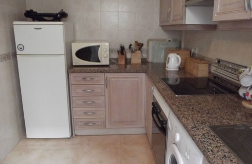 Los Arenales del Sol Apartment | Ground floor corner apartment with WIFI, spacious sunbathing area and pool views