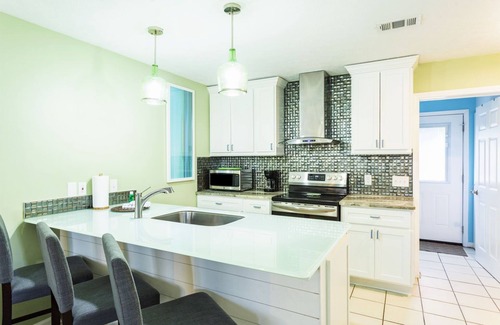 Panama City Beach Villa | Gulf View Condo with Pool & Grills. Minute walk to Beach. Pet-Friendly!