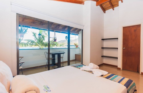 Guatape Hotel | Hermosa Habitación Deluxe Familiar En Guatape