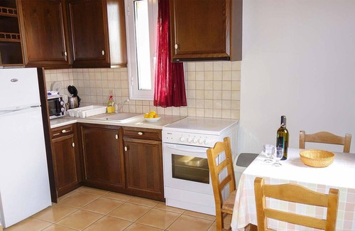 Kardamyli House | Hidden away on the outskirts of the quaint, little village of Kardamili, this traditional stone hous