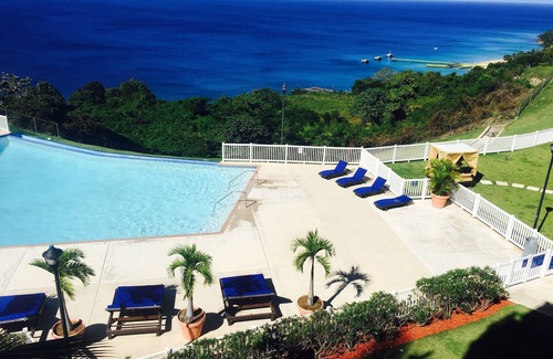 Borinquen Condo | High atop the BLUFF Overlooking Spectacular Ocean View of Crashboat Beach at PDM