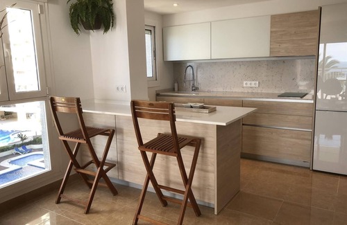 Calpe City Center Apartment | Holiday Apartment 'Front Line on the Beach' with Sea View, Swimming Pool, Garden & Wi-Fi