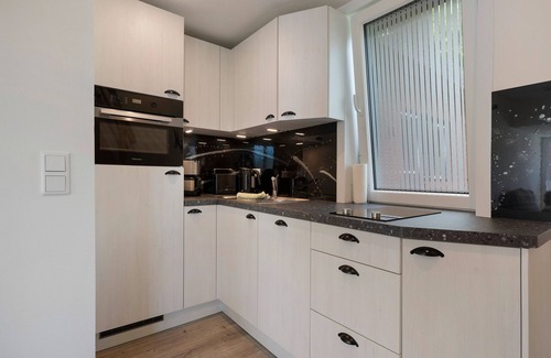 Ostersiel Apartment | Holiday Apartment 'Heinz Rolefs' with Shared Terrace, Communal Garden and Wi-Fi