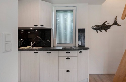 Ostersiel Apartment | Holiday Apartment 'Heinz Rolefs' with Shared Terrace, Communal Garden and Wi-Fi