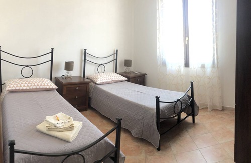 Palmadula House | Holiday Apartment "Tra Alghero e Stintino" with Air Conditioning, Terrace & Sea View