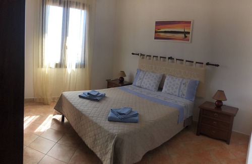 Palmadula House | Holiday Apartment "Tra Alghero e Stintino" with Air Conditioning, Terrace & Sea View