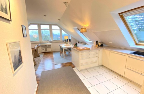 Wellsee House | Holiday apartment with a parking space, surrounded by greenery