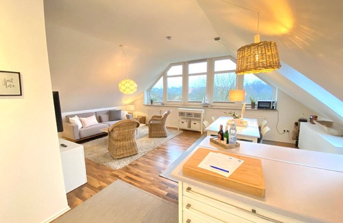 Wellsee House | Holiday apartment with a parking space, surrounded by greenery