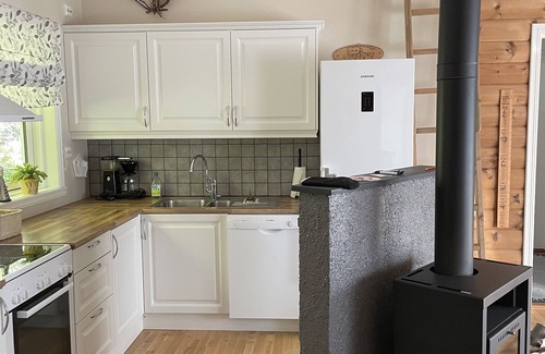 Hareid Cabin | Holiday home with view plot beyond Fjord and mountains.