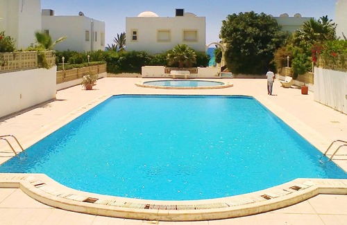 Les Deux Oueds Apartment | Homerez - 50 m away from the beach! Nice appartement for 6 ppl. with shared pool