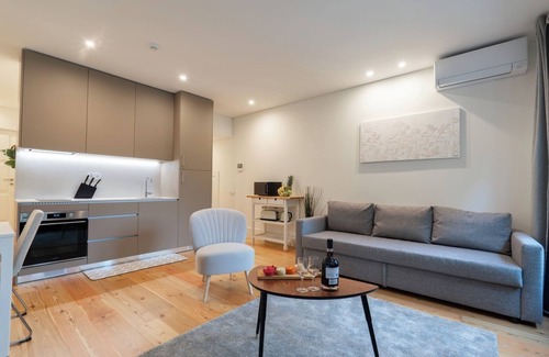 Guimaraes Apartment | HostWise - Sunny Flats w/Balcony