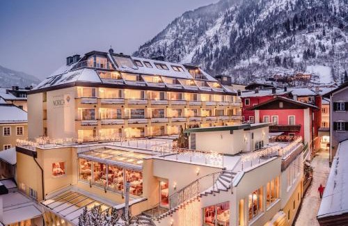 Bad Hofgastein Hotel | Hotel Norica - Thermenhotels Gastein mit dem Bademantel direkt in die Therme