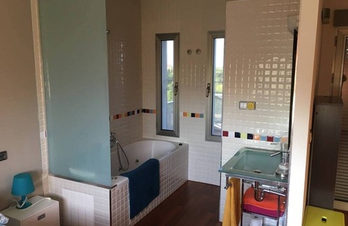 Pego Ski Chalet | house among orange trees .