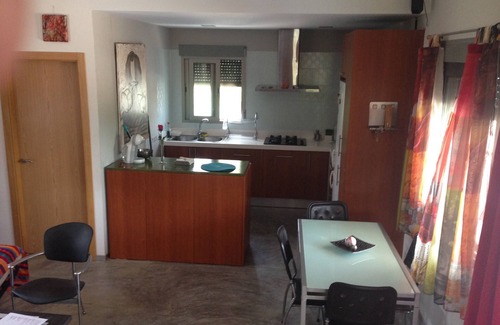 Pego Ski Chalet | house among orange trees .