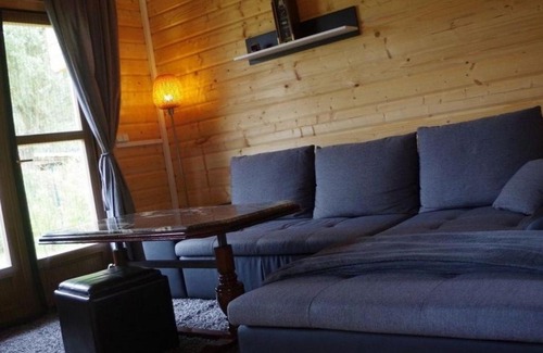 Schumachersiedlung House | Idyllische Holzhütte mit Wasserzugang und Sauna