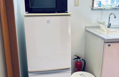 Yufuin Onsen House | In a quiet, green environment, with free parking, your room is in the middle of the ocean, you have your own spacious wooden room, a spacious living room with outdoor seating, and your own private garden with a roast fireplace.